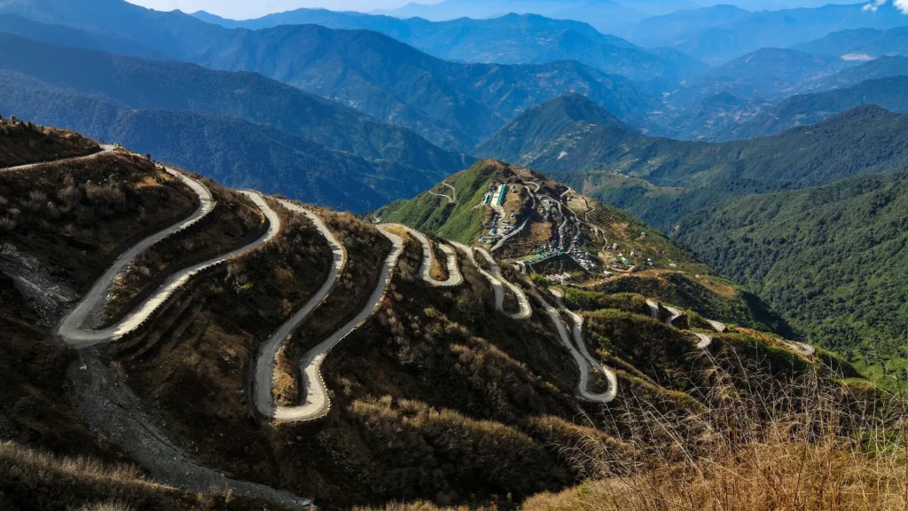 Winding hairpin bends of the historic Zuluk Silk Route traversing the scenic mountains of Sikkim.
